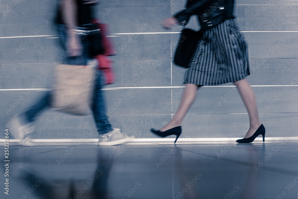 Naklejka premium Closeup of busy people at rush hour walking on city street