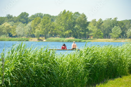 Ol pair man and woman enjoy time at lake 