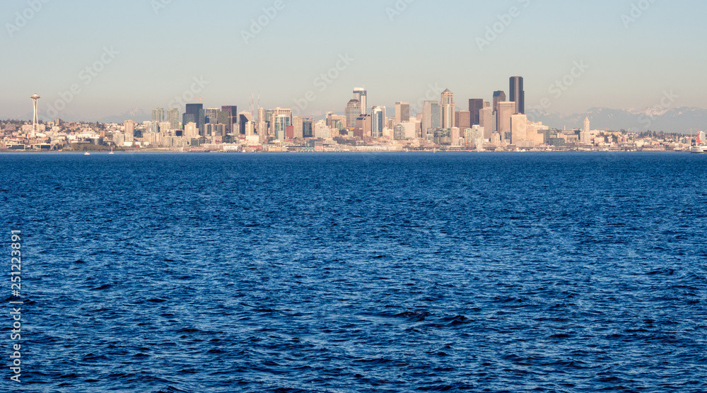 View of Seattle waterfront from the sea at sunset