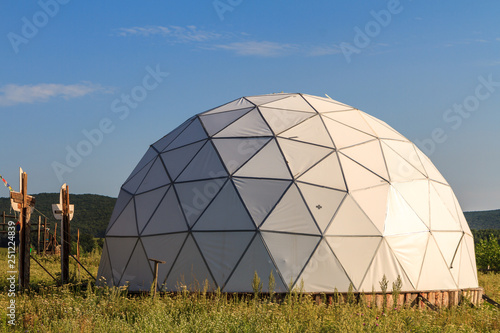 Schilderij op canvas white geodesic dome on sunny summer day
