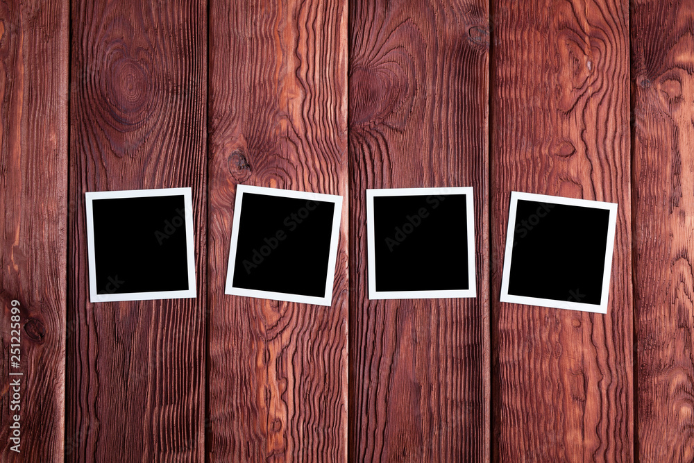Classic photo frames on wooden board Classic photo frames on wooden board