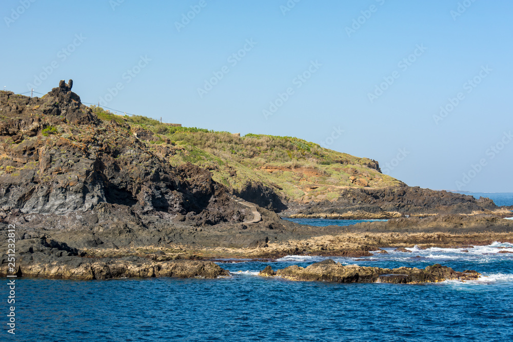 Fototapeta premium Spectacular vulcanic coastline shapped with lava forms.