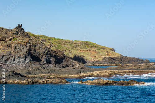 Spectacular vulcanic coastline shapped with lava forms.