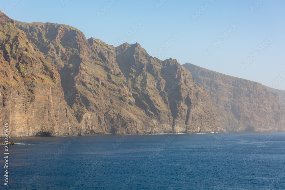 Sheer cliffs of Los Gigantes raising above Atlantic ocean.
