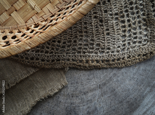 Background from cross section of tree trunk, natural linen napkins and a straw basket