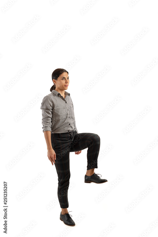 Young businesswoman isolated on white background doing exercises Young businesswoman isolated on white background doing exercises