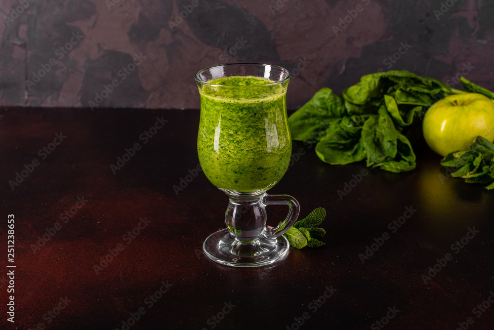 Ginger green apple smoothie on concrete background. It can be used as a background Ginger green apple smoothie on concrete background. It can be used as a background