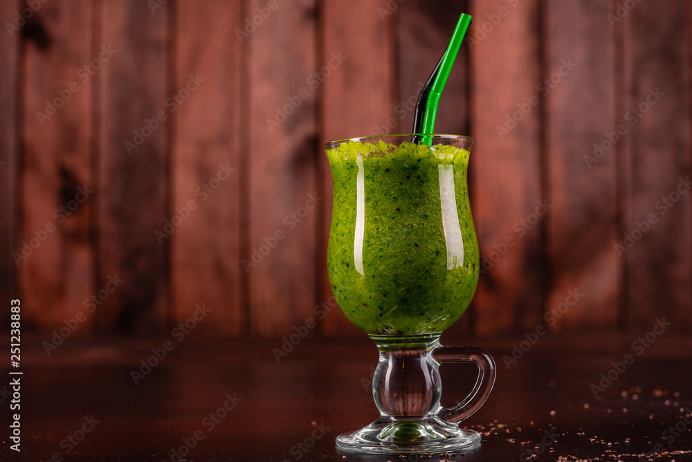 Fototapeta premium Ginger green apple smoothie on concrete background. It can be used as a background