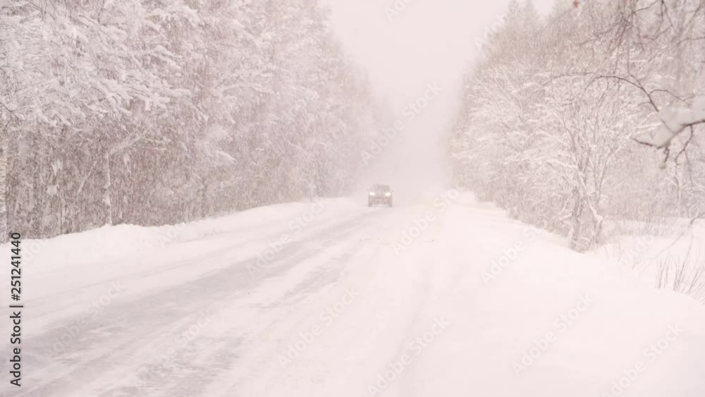 The snow is raining hard on the streets on a winter season The snow is raining hard on the streets on a winter season