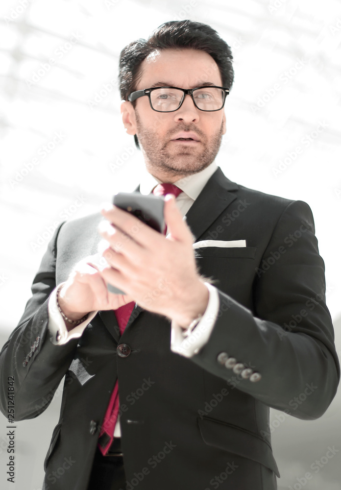 businessman reading text message on smartphone businessman reading text message on smartphone