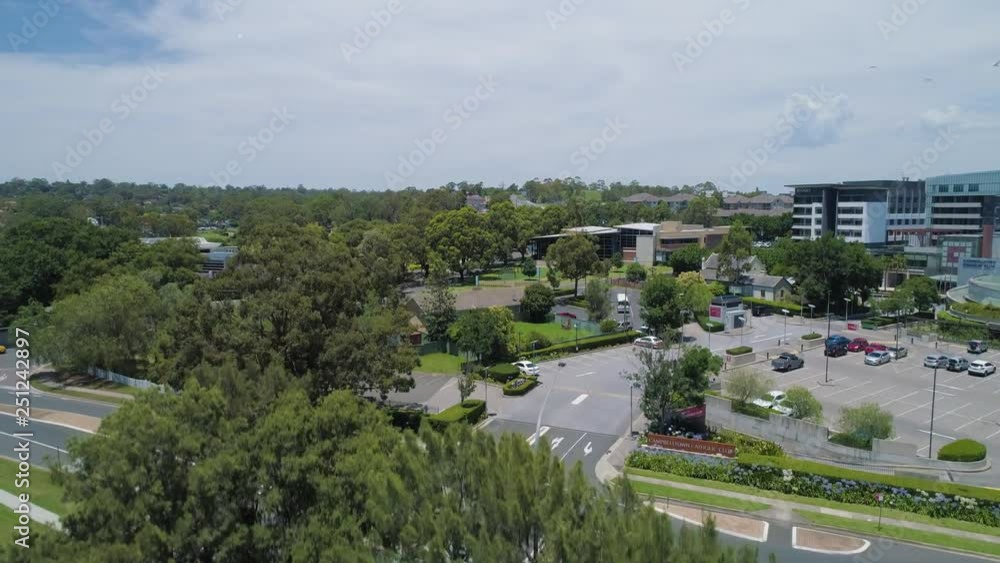Slow aerial rise above trees revealing suburban area in Sydney, Australia Slow aerial rise above trees revealing suburban area in Sydney, Australia