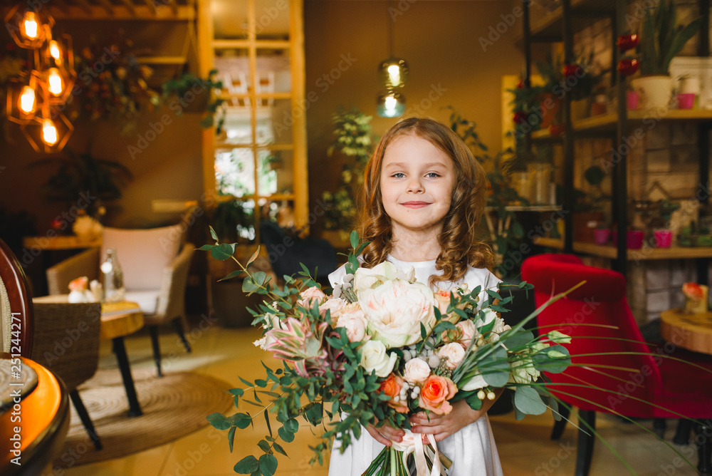 Mom and son with flowers in caffe. Son give flowers to mother. cute family. International women`s day, 8 march celebrating Mom and son with flowers in caffe. Son give flowers to mother. cute family. International women`s day, 8 march celebrating