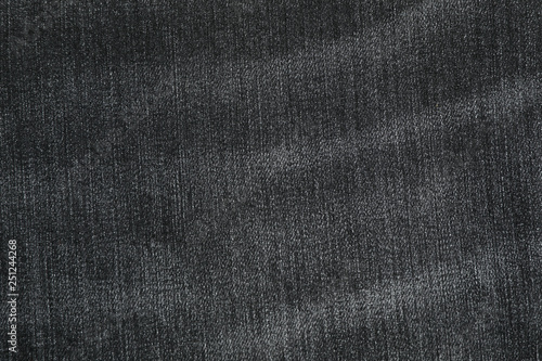 Texture of black jeans as background, space for text