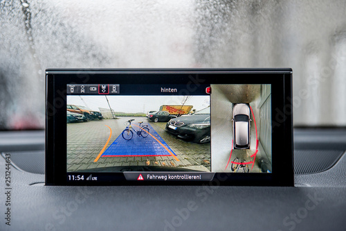 Modern backup camera monitor in car show obstacles