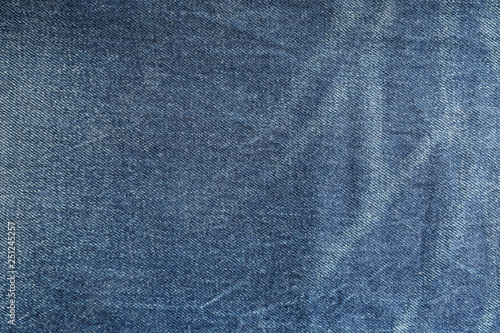 Texture of blue jeans as background, space for text