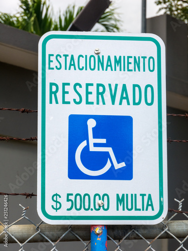 "Disabled parking sign only" in Spanish language. Puerto Rico, USA.