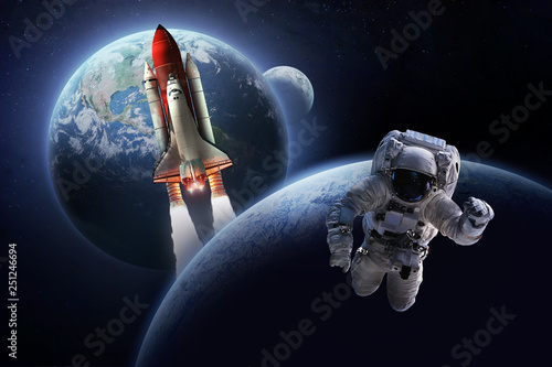 Fototapeta Naklejka Na Ścianę i Meble -  Astronaut in the space over the planet Earth. Shuttle, rocket and Moon on background. Sci-fi wallpaper. Spaceman. Elements of this image furnished by NASA