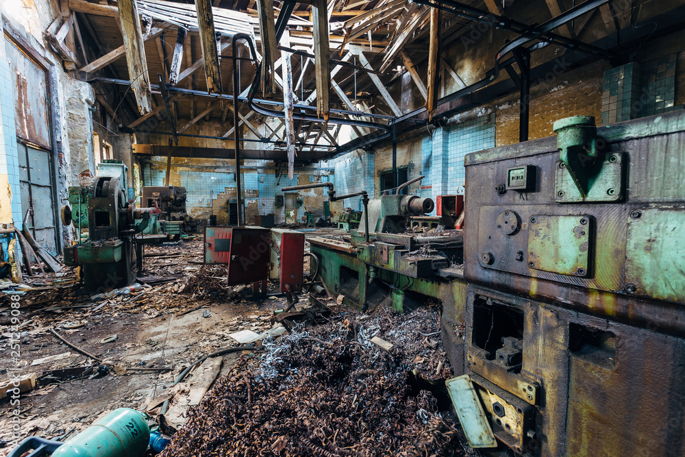 Old industrial machine tools in workshop. Rusty metal equipment in abandoned  factory Stock Photo | Adobe Stock