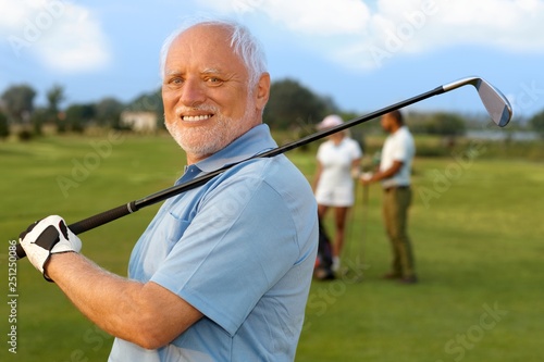 Portrait of mature male golfer photo
