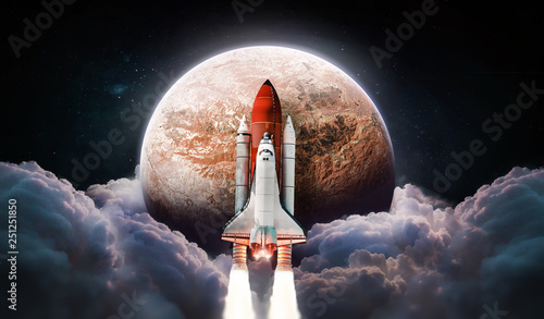 Fototapeta Naklejka Na Ścianę i Meble -  Rocket near red planet Mars with clouds and space on background. Space shuttle. Colonization and space exploration. Elements of this image furnished by NASA.