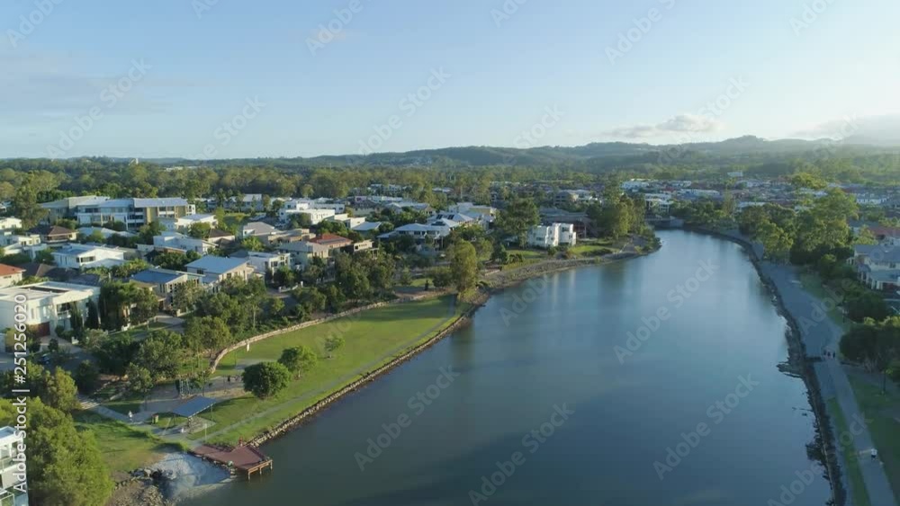 Slow rise over Reedy Creek and Varsity Lakes luxury suburb at sunset. Gold Coast, Queensland, Australia Slow rise over Reedy Creek and Varsity Lakes luxury suburb at sunset. Gold Coast, Queensland, Australia