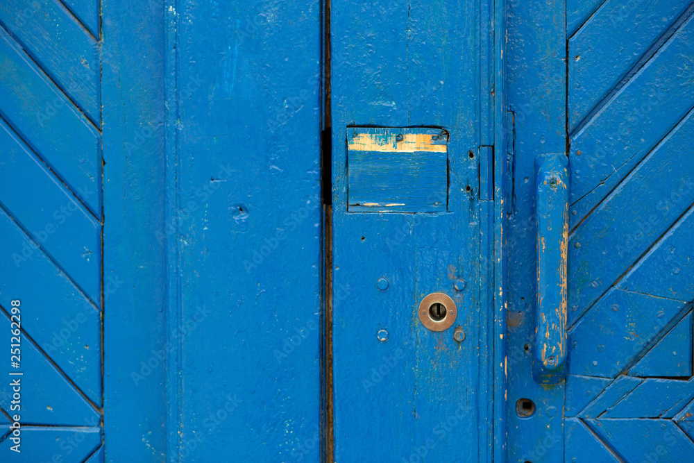 Closeup shot of old painted blue door outside. Copy space Closeup shot of old painted blue door outside. Copy space