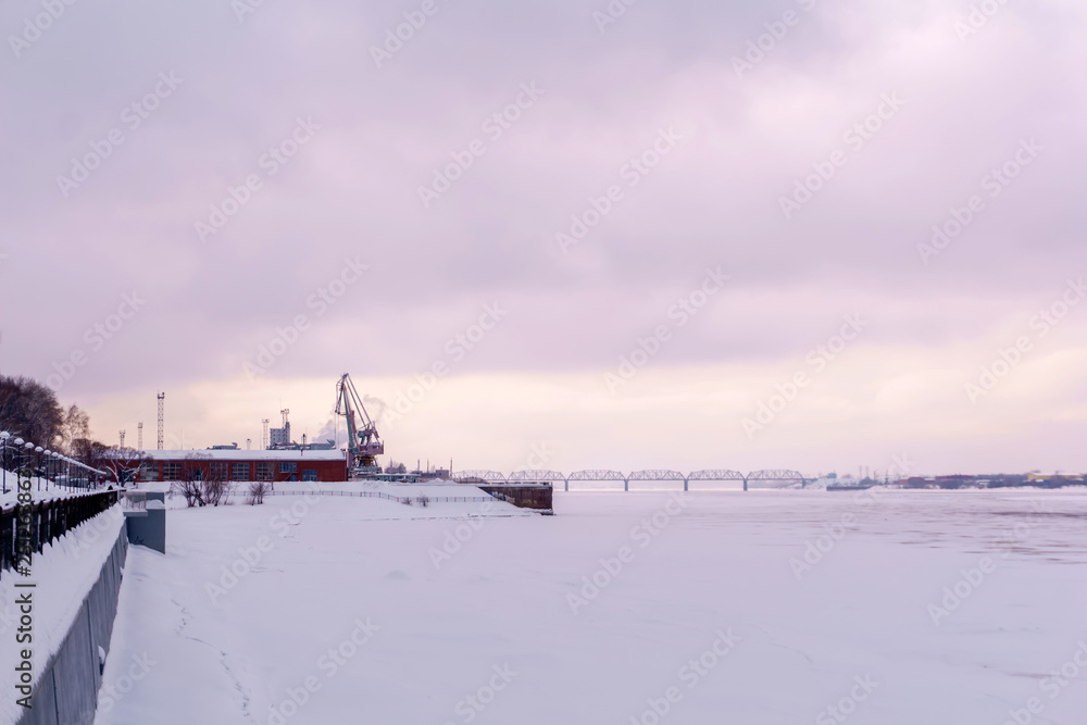 Fototapeta premium frozen river, cargo port and quay