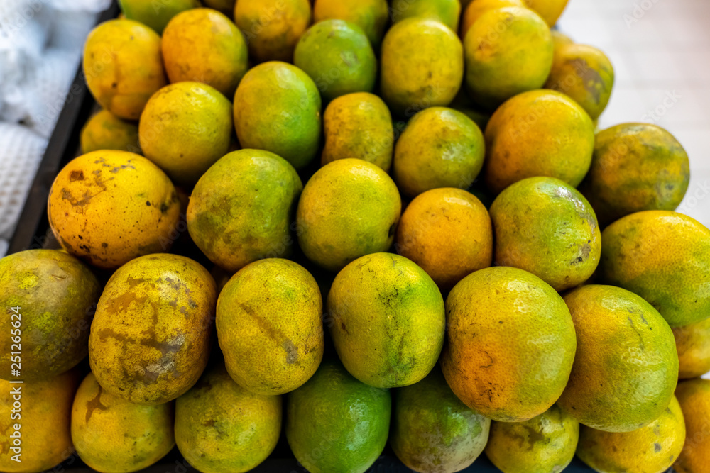 Fresh organic mandarins on a local food market, Bali island. Indonesia. Fresh organic mandarins on a local food market, Bali island. Indonesia.