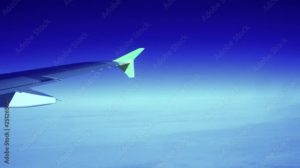 Wing aircraft flying high above the clouds. The horizon of the earth. Evening time. Wing aircraft flying high above the clouds. The horizon of the earth. Evening time.