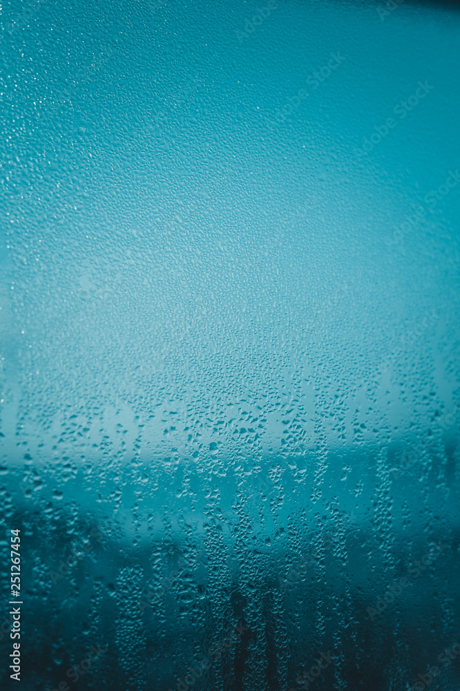 Close up on condensated water foggy window glass natural textured background. Close up on condensated water foggy window glass natural textured background.