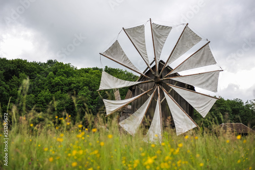 Old windmill in field