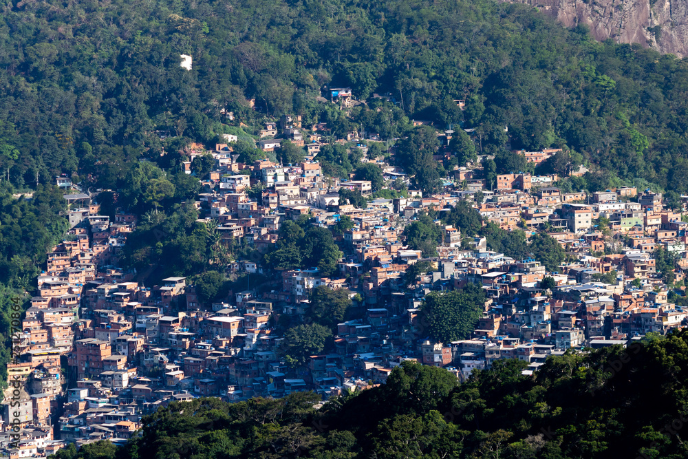 Fototapeta premium Aerial view of Favela da Rocinha, Biggest Slum in Brazil on the Two Brothers Mountain in Rio de Janeiro