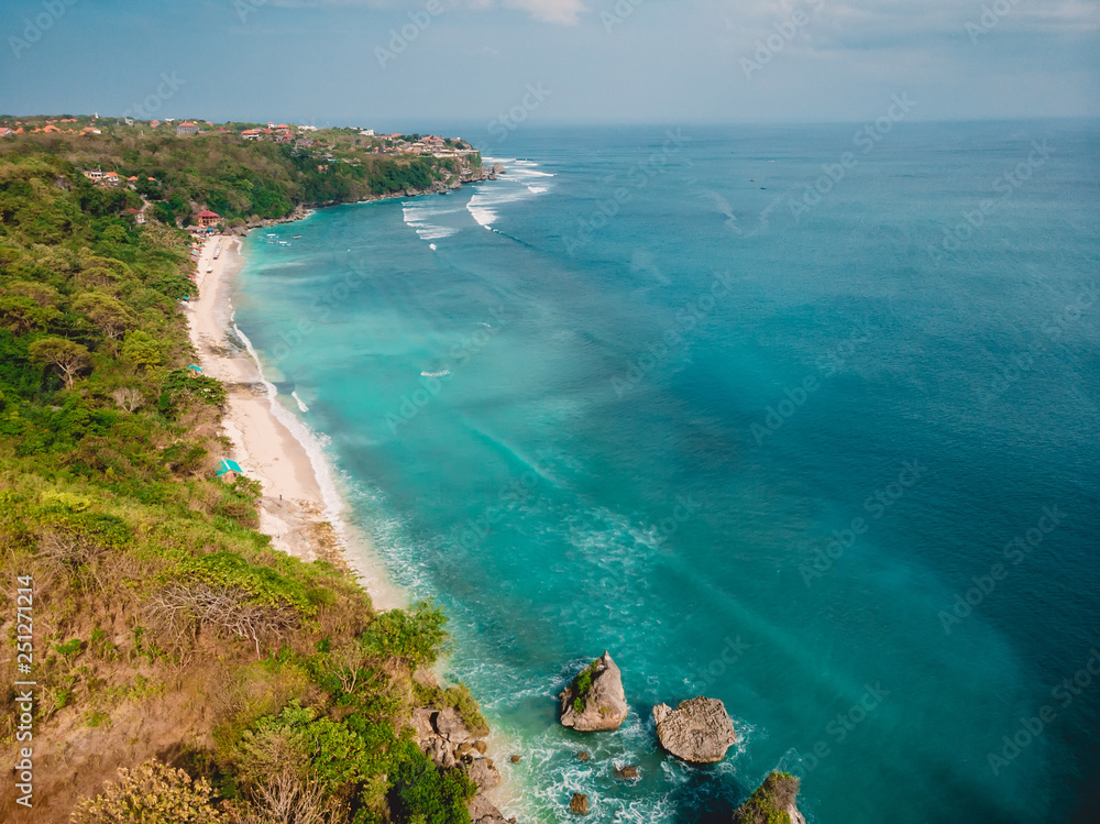 Beautiful beach with turquoise ocean in Bali, aerial drone shot