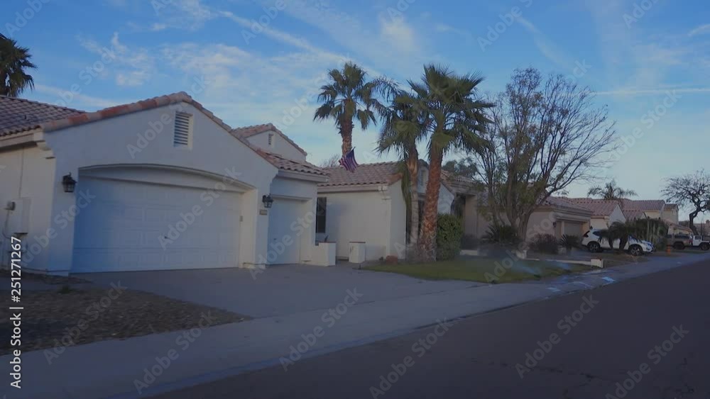 A three-quarter view driving in a typical Arizona residential neighborhood. Phoenix suburbs. A three-quarter view driving in a typical Arizona residential neighborhood. Phoenix suburbs.
