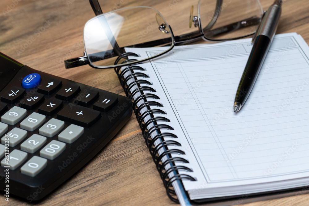 calculator notebook and glasses calculator notebook and glasses