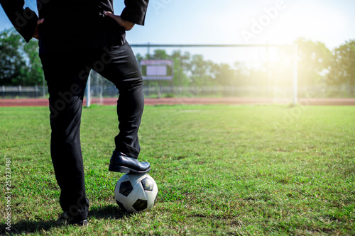 business man in working suit with footbal