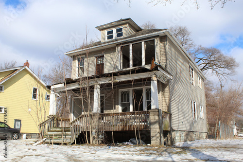 Detroit abandoned American Foursquare home in Martin Park in winter