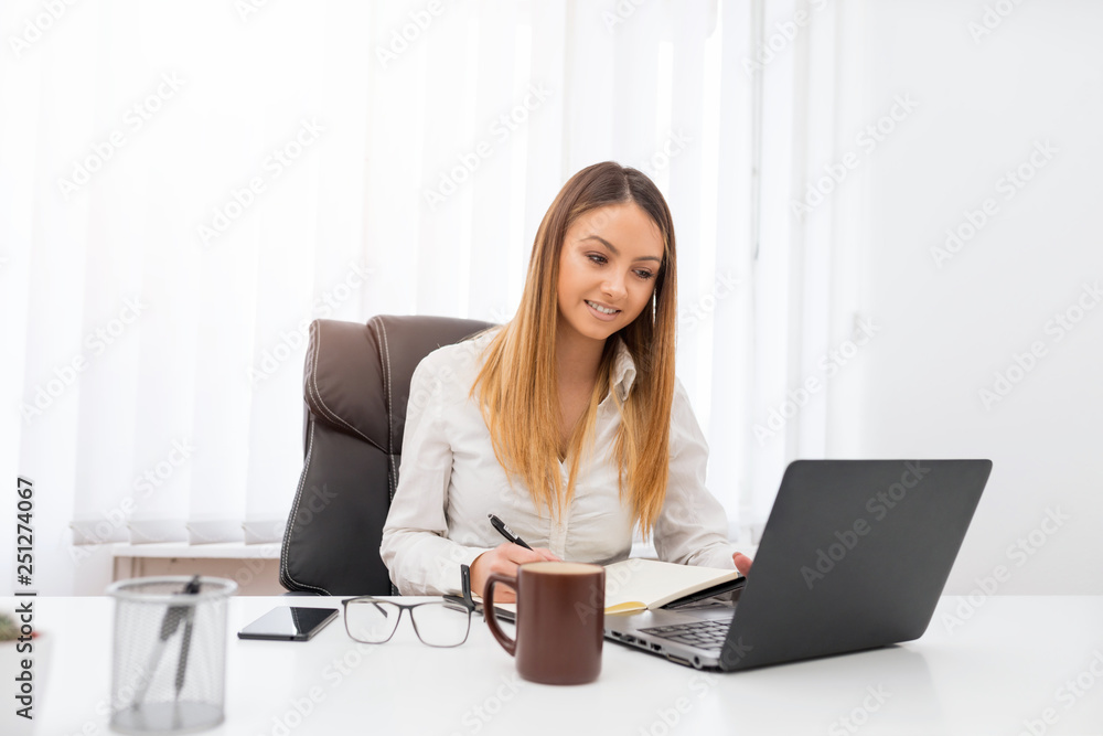 A young successful female entrepreneur has managed to do her job and she feels great about it. A young successful female entrepreneur has managed to do her job and she feels great about it.