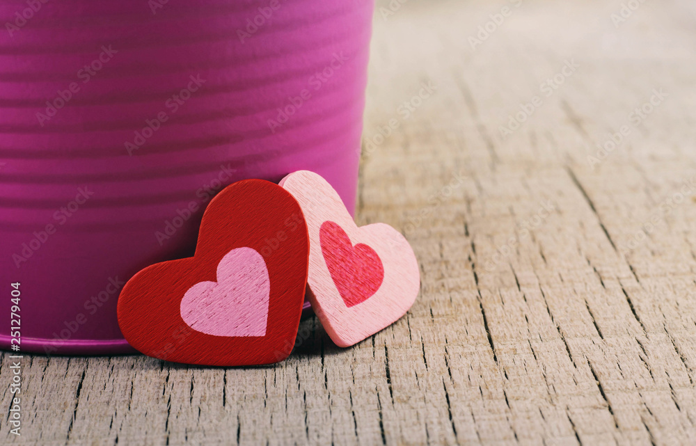 Fototapeta premium hearts and vases on wood.