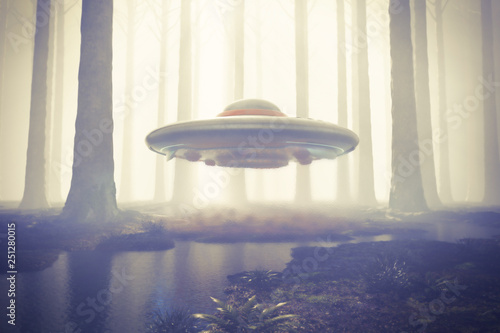 Valokuva Scene of a UFO hovering in the woods with magnetic field shimmer below its surface