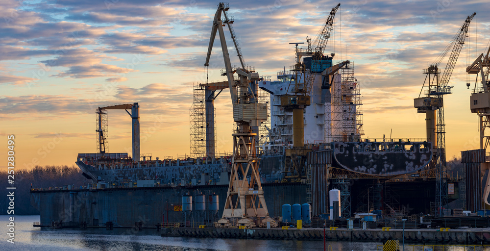 merchant ship in the dry dock of the repair yard merchant ship in the dry dock of the repair yard
