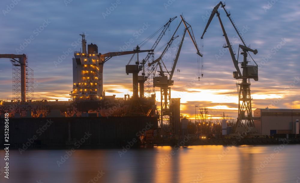 merchant ship in the dry dock of the repair yard