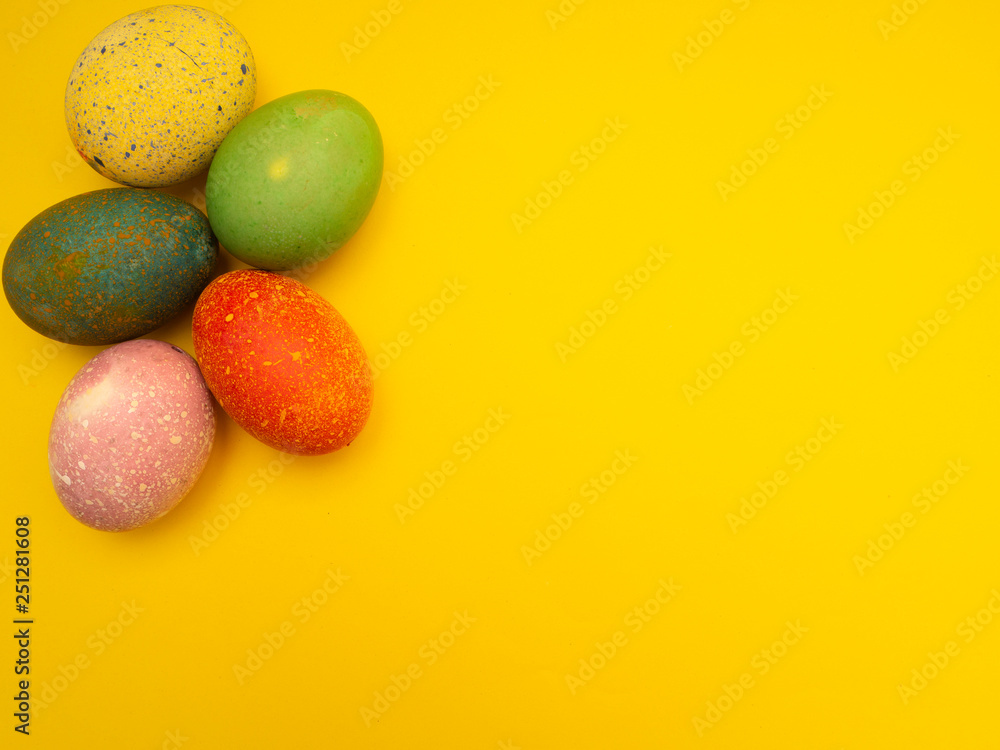 Colorful Easter Eggs On Yellow Background