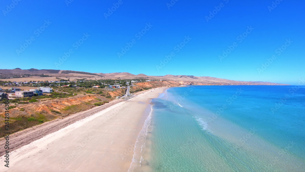 Drone aerial view of Australian wide open beach and coastline, taken at Sellicks Beach, South Australia.