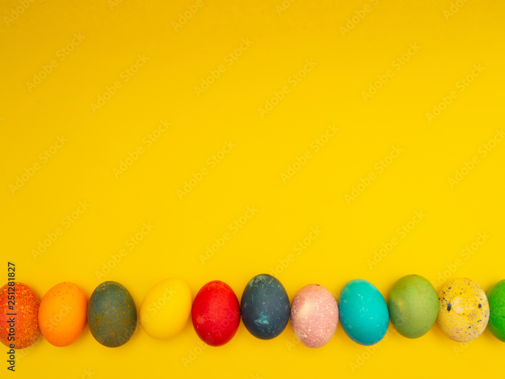 Obraz premium Colorful Easter Eggs On Yellow Background