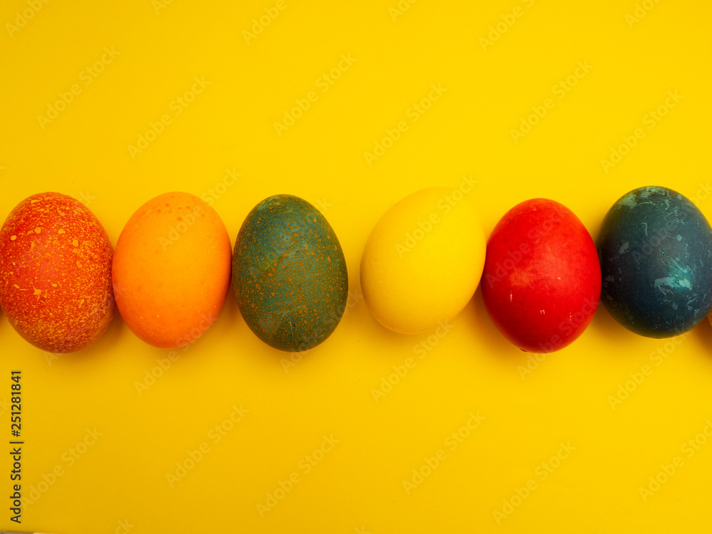 Colorful Easter Eggs On Yellow Background Colorful Easter Eggs On Yellow Background