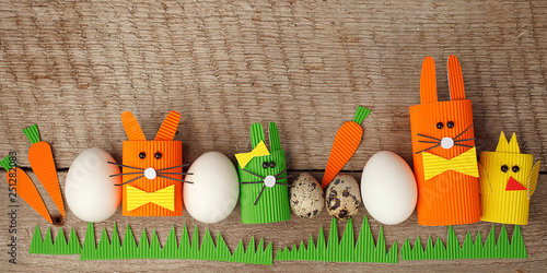 Photography Easter eggs, rabbits and chikens on wood vintage background with copy space, eas