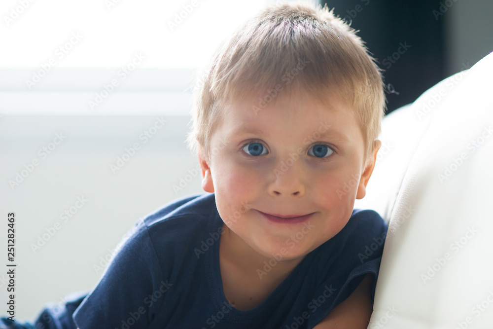 Portrait of happy smiling boy. Attractive kid at home. Portrait of happy smiling boy. Attractive kid at home.