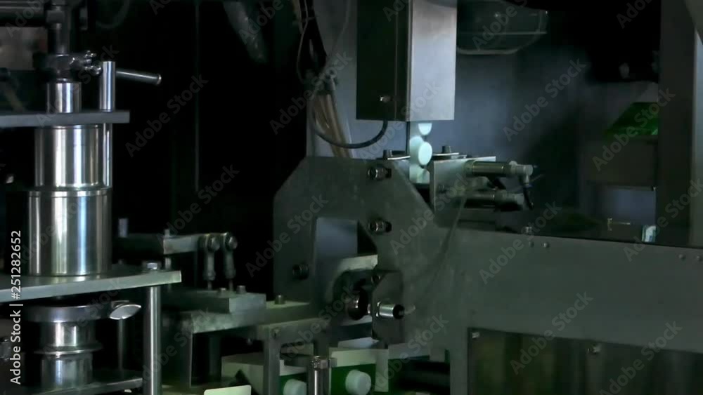 The conveyor of filling and packaging of drinks in cardboard container. equipment at the dairy plant The conveyor of filling and packaging of drinks in cardboard container. equipment at the dairy plant
