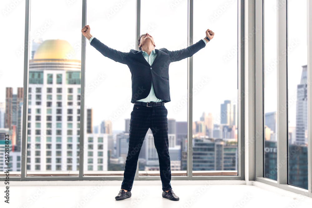 Successful of businessman in black elegant suit standing celebrating ...